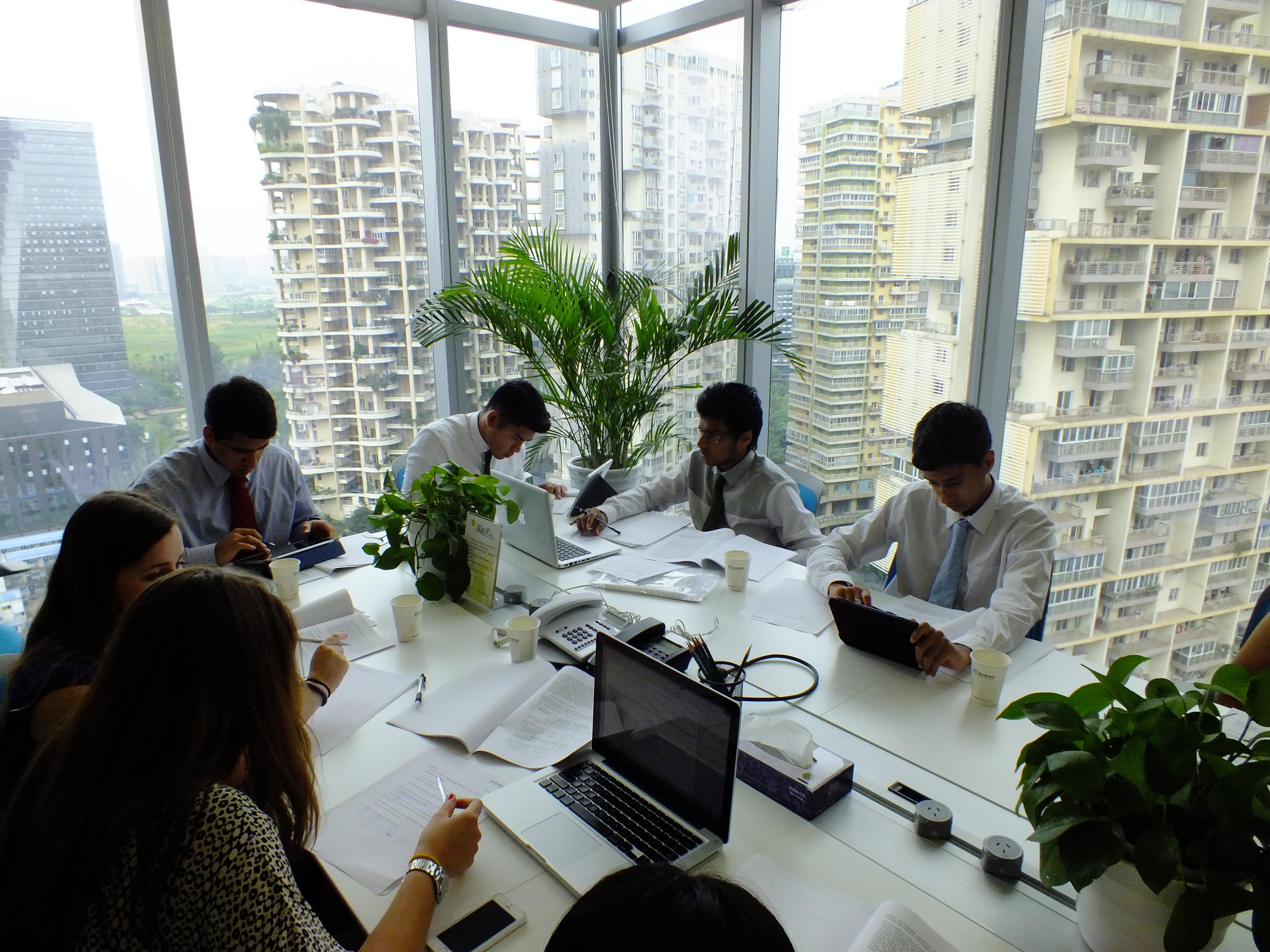 A group of legal interns attend a meeting with local lawyers at a legal firm in China. Projects Abroad Law interns attend a meeting run by experienced local lawyers at a firm as part of their Law internship in China.